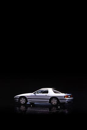 1985 Mazda RX-7 phone wallpaper thumbnail.