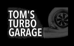 Tom's Turbo Garage logo.